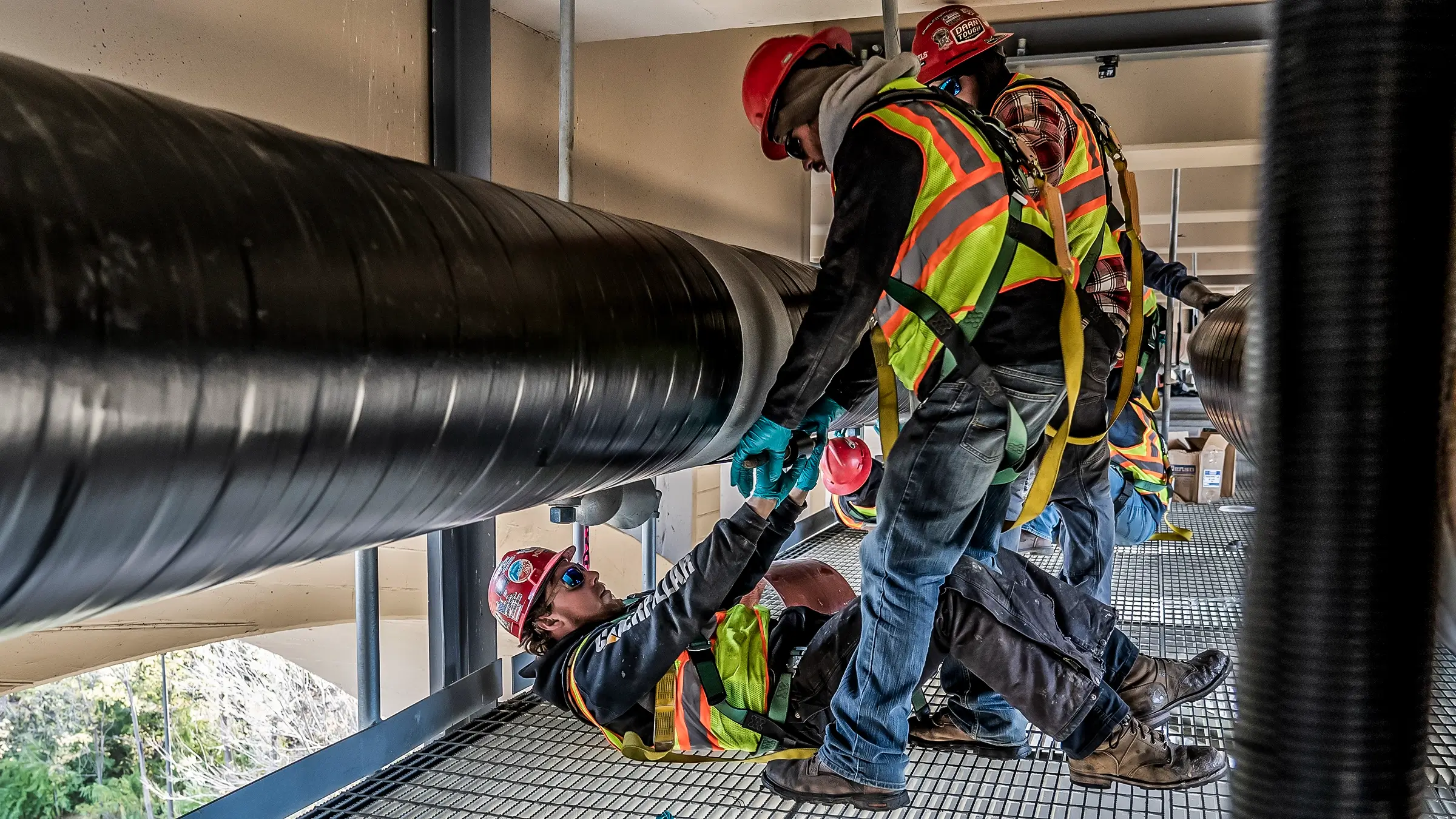 Several crew members work under the 10th Ave bridge in Minnesota.