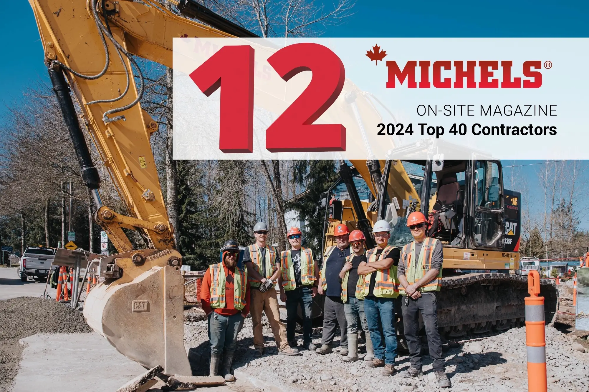 A group of employees stand near an excavator.