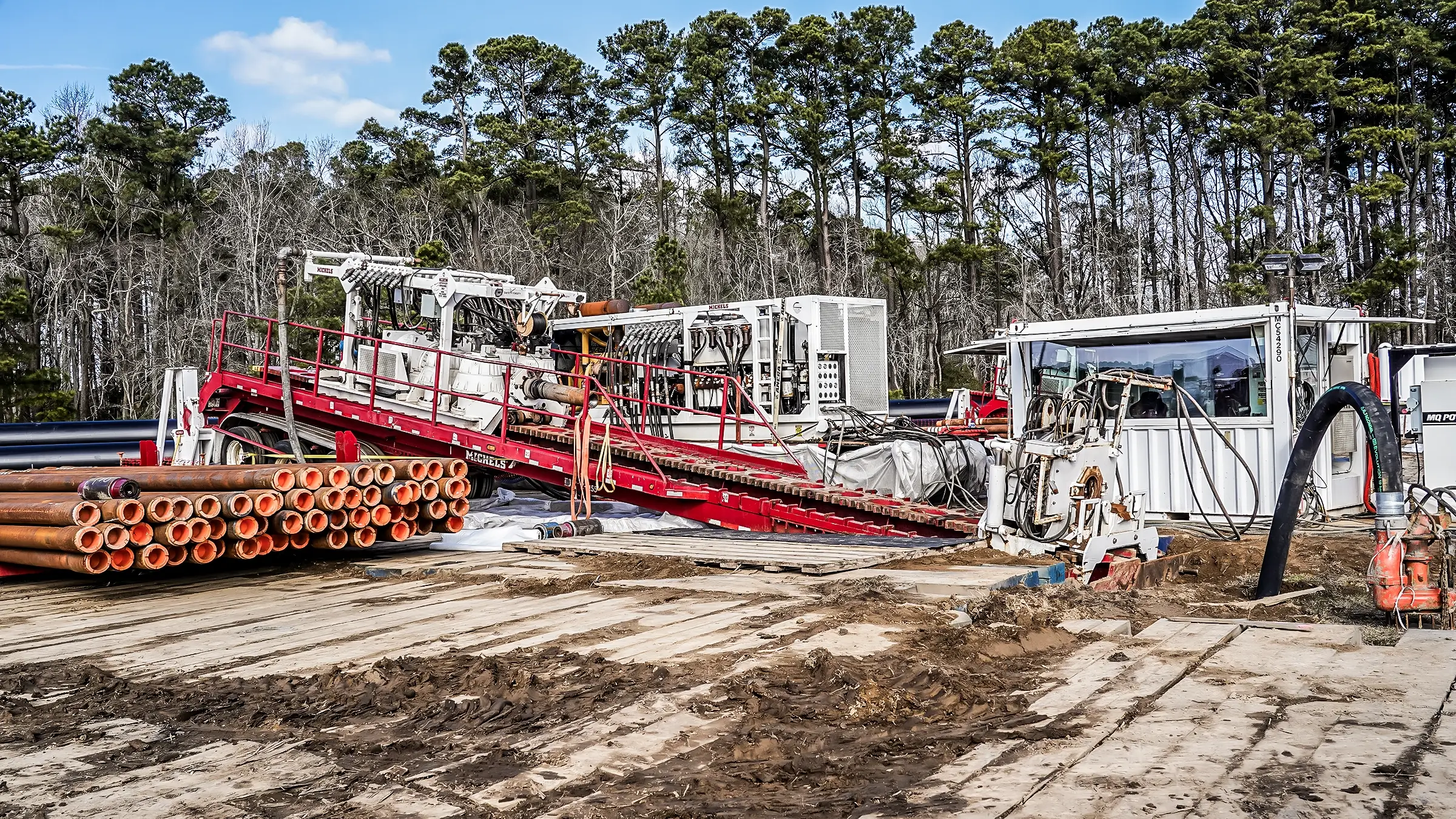 A Horizontal Directional Drill (HDD) rig setup on a jobsite.