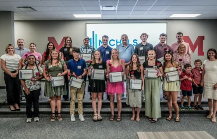 A group of scholarship winners standing together.