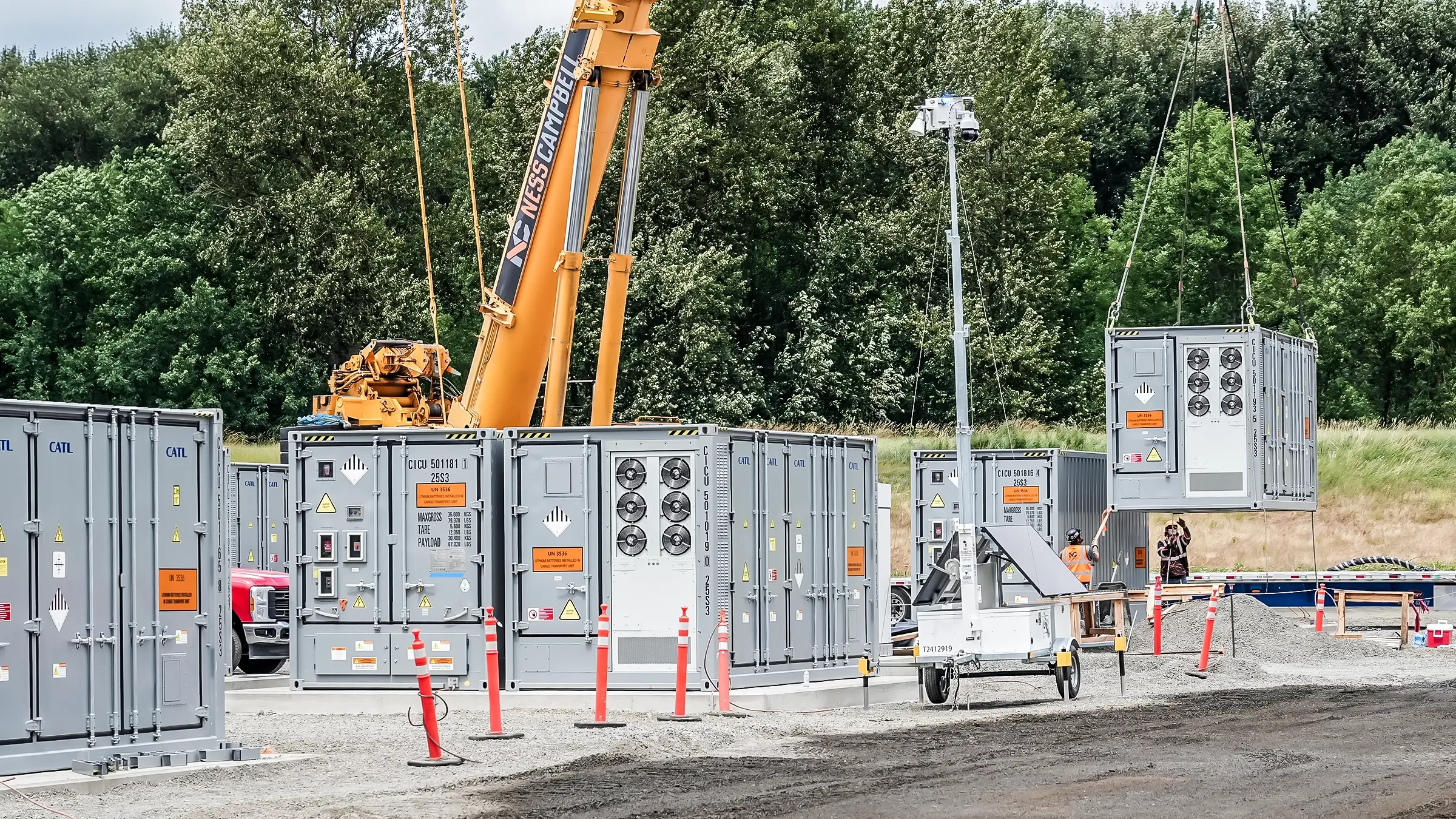 A crane placing BESS parts in place.